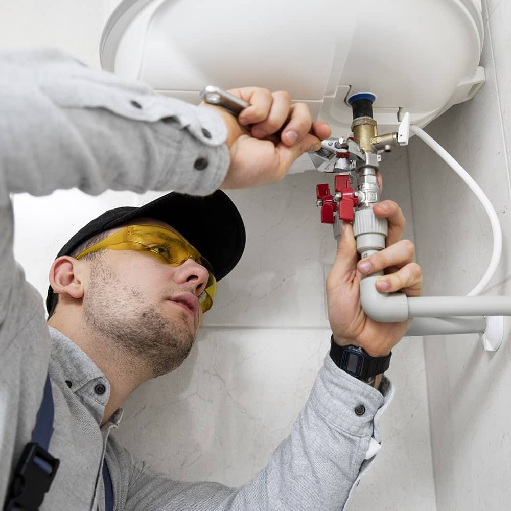 Plumber performing property maintenance on a Gold Coast investment property